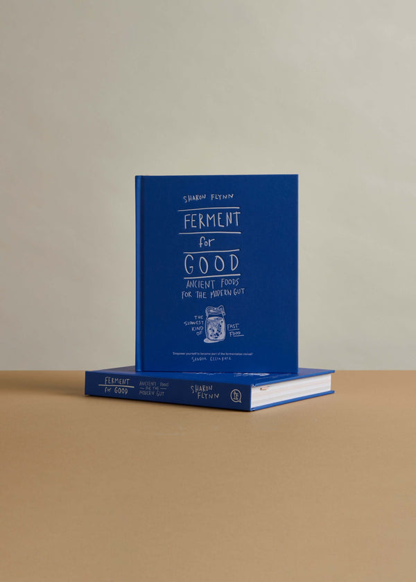 Cover of Ferment for Good - the ultimate wild fermentation guide by Sharon Flynn, featuring a blue design.