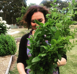sharon flynn holding a large bunch of mint