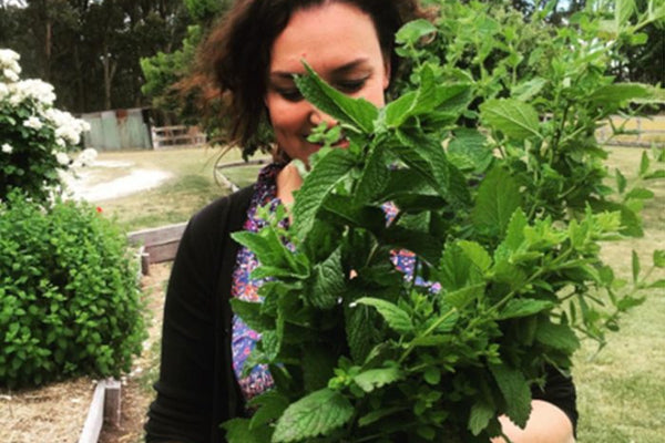 sharon flynn holding a large bunch of mint